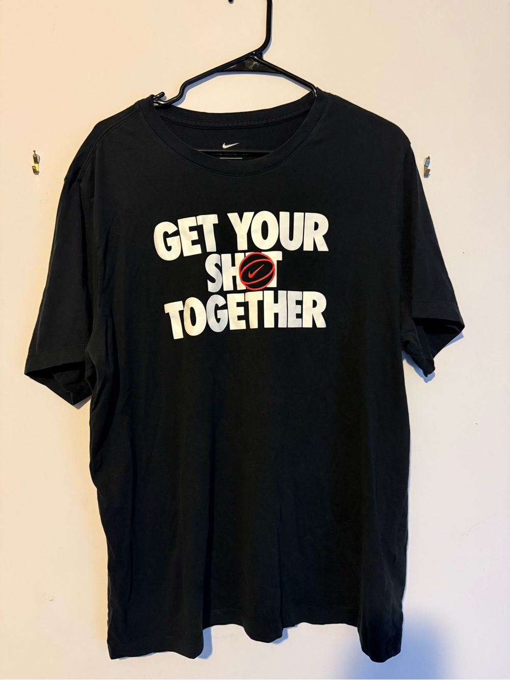 Nike Black Short-Sleeve Graphic Tee with White Text and Red Logo